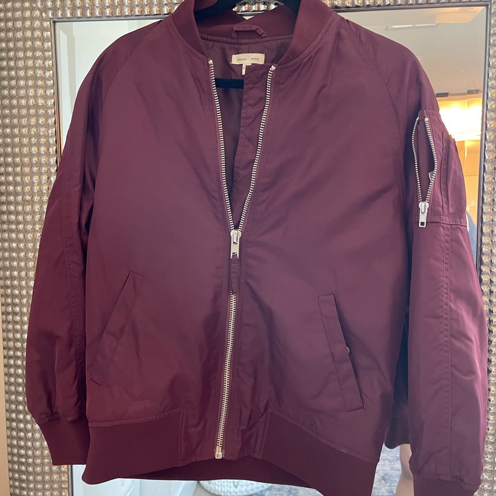 Burgundy bomber jacket.